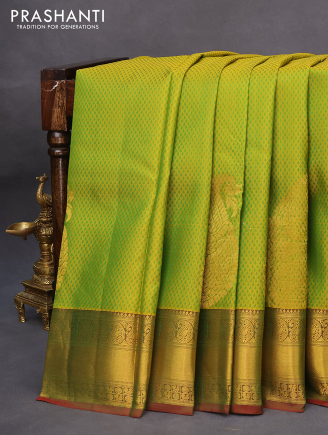 Pure kanchipuram silk saree dual shade of light green and dual shade of maroonish green with allover self emboss & zari buttas and rich zari woven border