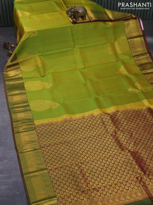 Pure kanchipuram silk saree dual shade of light green and dual shade of maroonish green with allover self emboss & zari buttas and rich zari woven border