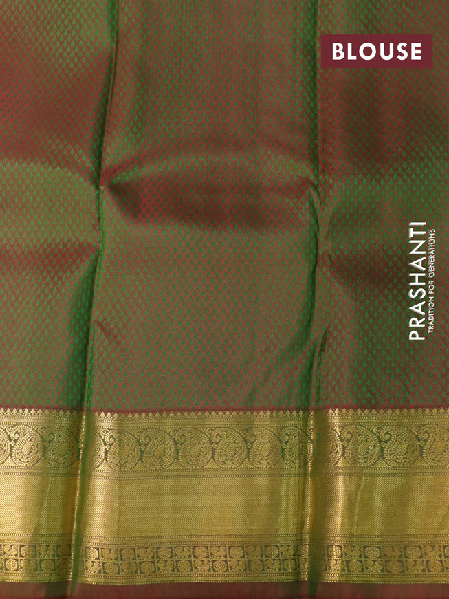 Pure kanchipuram silk saree dual shade of light green and dual shade of maroonish green with allover self emboss & zari buttas and rich zari woven border