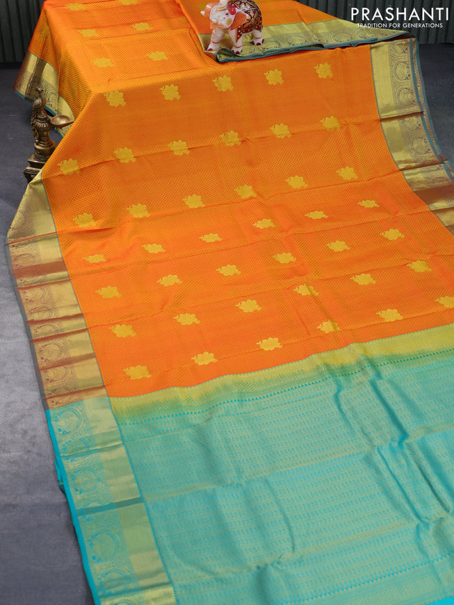 Pure kanchipuram silk saree dual shade of mango yellow and teal green with allover self emboss & zari buttas and zari woven border