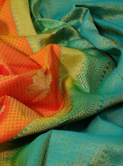 Pure kanchipuram silk saree dual shade of mango yellow and teal green with allover self emboss & zari buttas and zari woven border