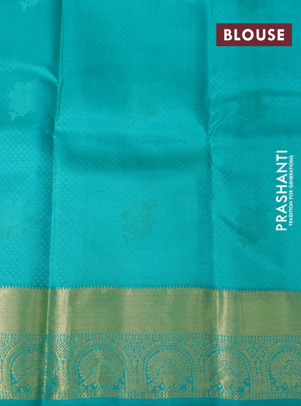 Pure kanchipuram silk saree dual shade of mango yellow and teal green with allover self emboss & zari buttas and zari woven border