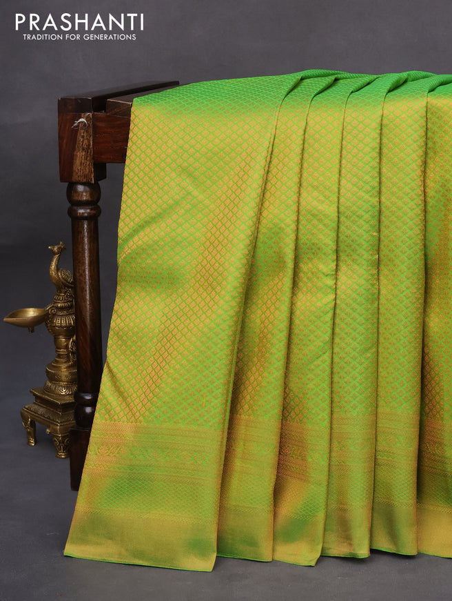 Pure kanchipuram silk saree light green and navy blue with allover copper zari woven brocade weaves and copper zari woven border