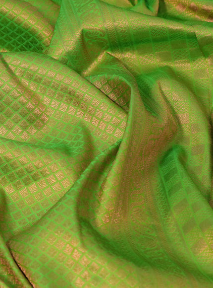 Pure kanchipuram silk saree light green and navy blue with allover copper zari woven brocade weaves and copper zari woven border