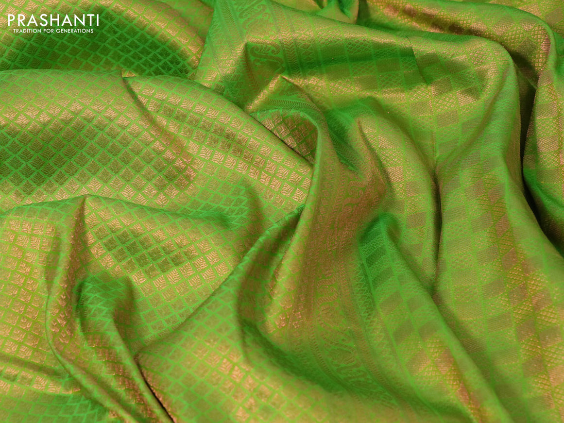 Pure kanchipuram silk saree light green and navy blue with allover copper zari woven brocade weaves and copper zari woven border