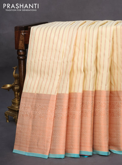 Pure kanchipuram silk saree cream and teal blue with allover copper zari weaves and long copper zari woven border