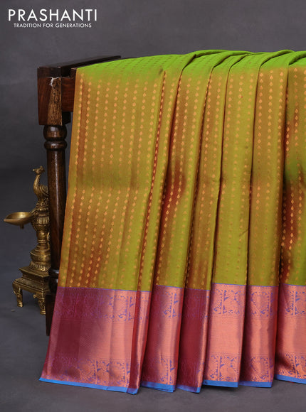 Pure kanchipuram silk saree dual shade of green and cs blue with allover zari woven butta weaves and copper zari woven annam border