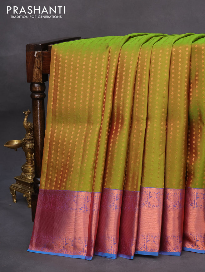 Pure kanchipuram silk saree dual shade of green and cs blue with allover zari woven butta weaves and copper zari woven annam border