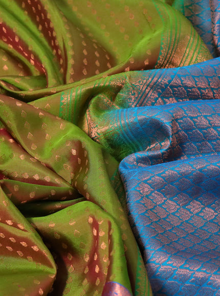 Pure kanchipuram silk saree dual shade of green and cs blue with allover zari woven butta weaves and copper zari woven annam border