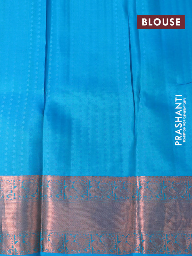 Pure kanchipuram silk saree dual shade of green and cs blue with allover zari woven butta weaves and copper zari woven annam border