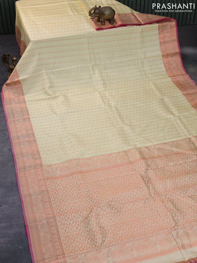 Pure kanchipuram silk saree cream and pink with allover copper zari woven butta weaves and copper zari woven border