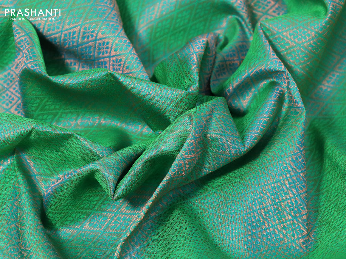 Pure kanchipuram silk saree dual shade of green and dark green with allover zari woven brocade weaves and zari woven border