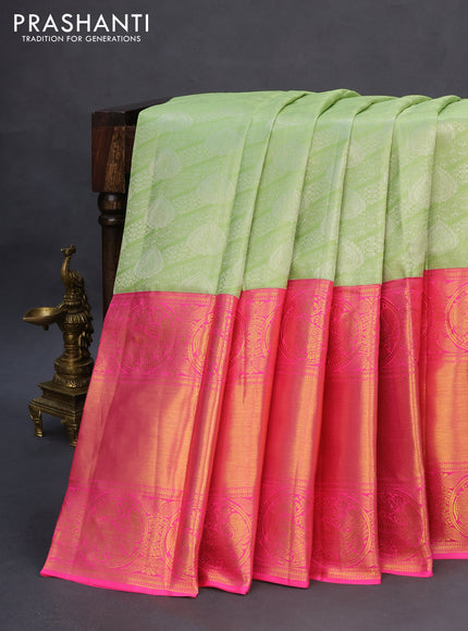 Pure kanchipuram silk saree pista green and pink with allover silver zari woven brocade weaves and long rich zari woven border