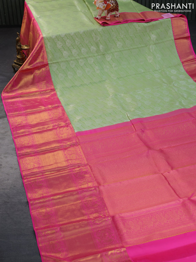 Pure kanchipuram silk saree pista green and pink with allover silver zari woven brocade weaves and long rich zari woven border