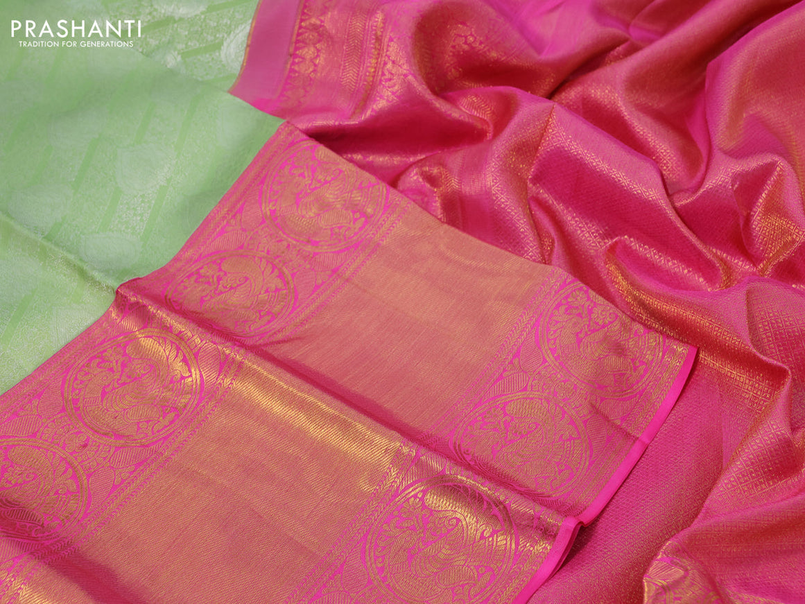 Pure kanchipuram silk saree pista green and pink with allover silver zari woven brocade weaves and long rich zari woven border