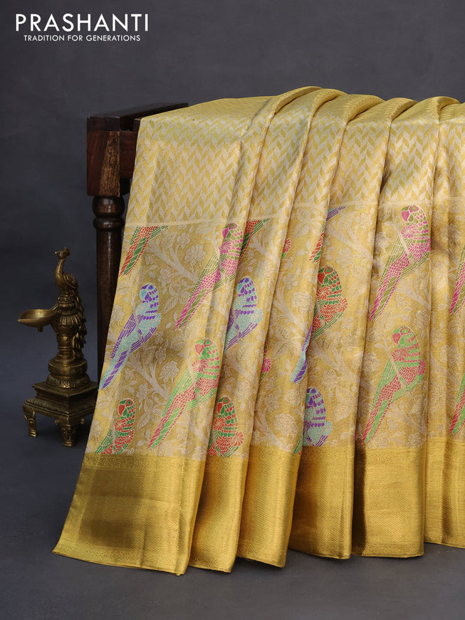 Pure kanchipuram tissue silk saree gold with allover zari woven brocade weaves and long parrot design zari woven border