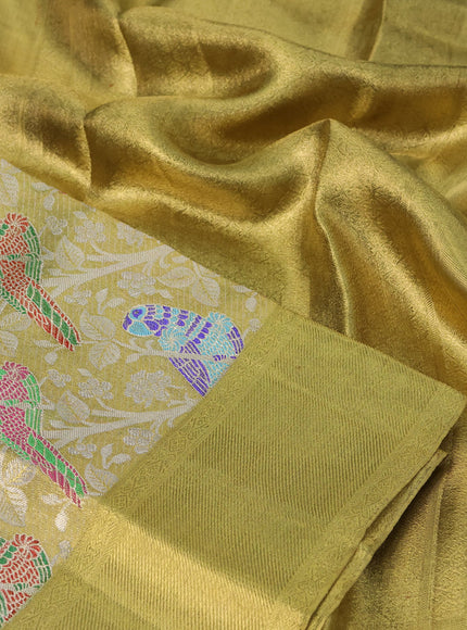 Pure kanchipuram tissue silk saree gold with allover zari woven brocade weaves and long parrot design zari woven border