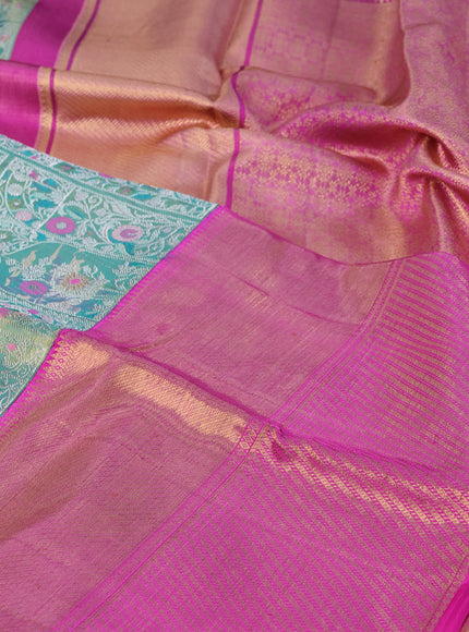 Pure kanchipuram tissue silk saree teal shade shade and pink with allover zari woven brocade weaves and long zari woven border