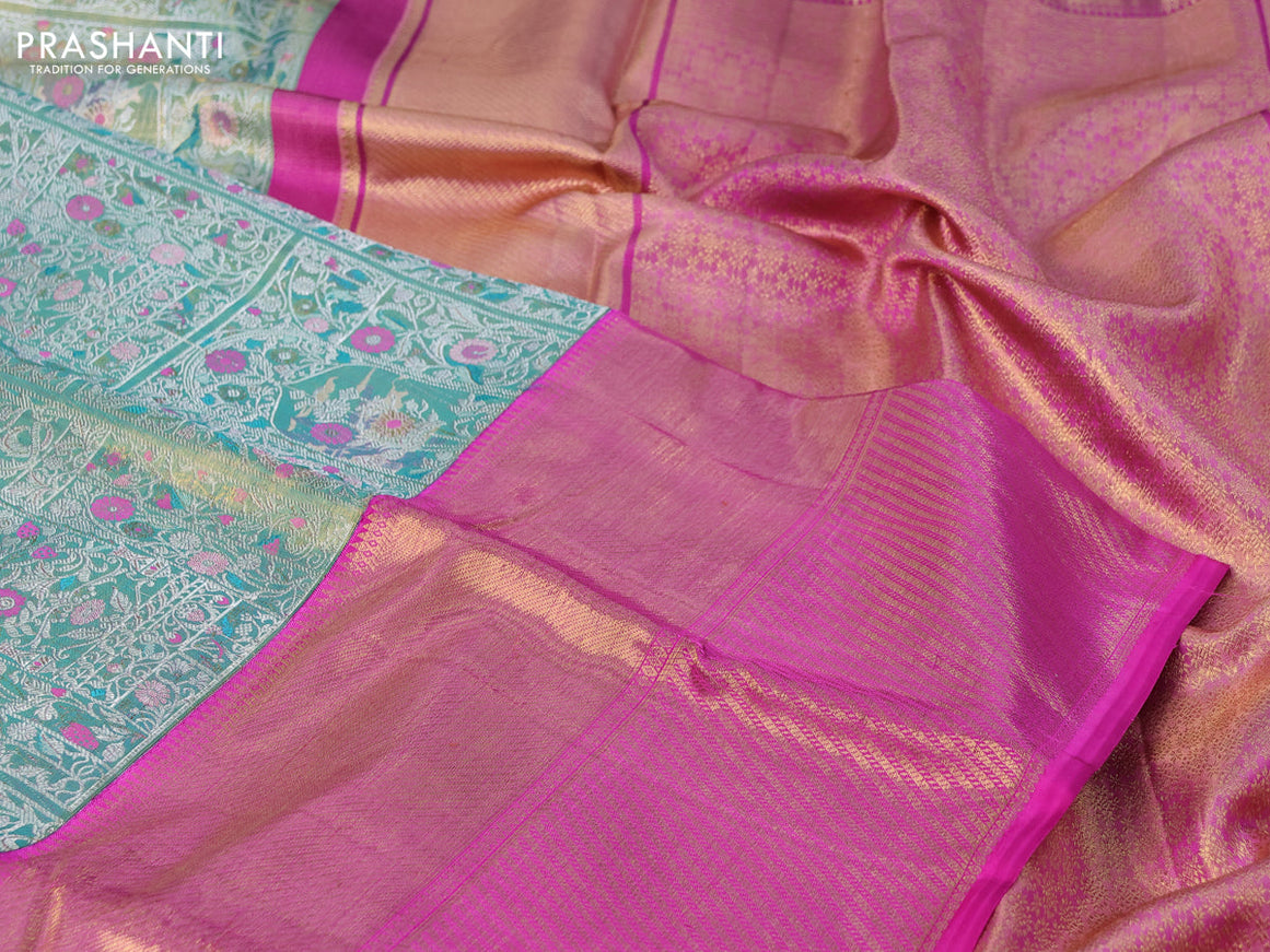 Pure kanchipuram tissue silk saree teal shade shade and pink with allover zari woven brocade weaves and long zari woven border