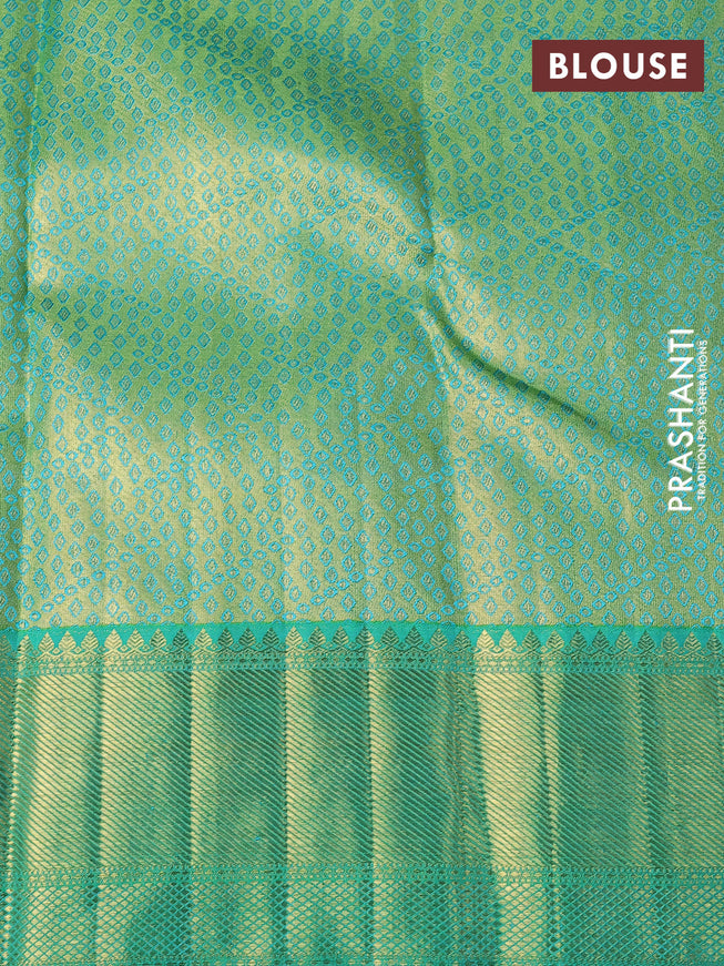 Pure kanchipuram tissue silk saree beige pink and dual shade of teal green with allover zari woven brocade weaves and zari woven border