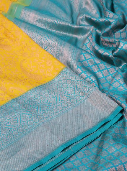 Pure kanchipuram silk saree mustard yellow and teal green with allover copper zari woven brocade weaves and copper zari woven border