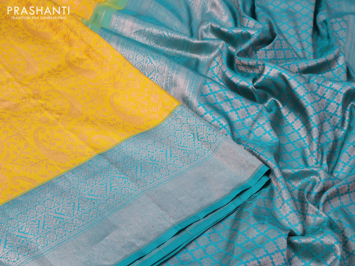 Pure kanchipuram silk saree mustard yellow and teal green with allover copper zari woven brocade weaves and copper zari woven border