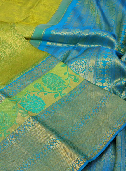 Pure kanchipuram silk saree dual shade of lime green and cs blue with allover zari woven brocade weaves and long thread & zari woven border