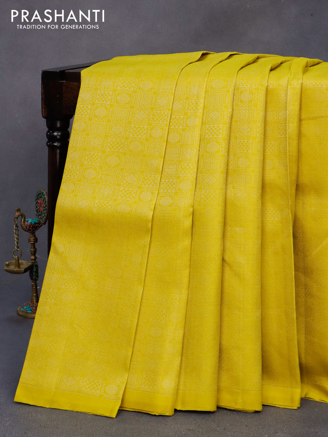 Pure soft silk saree lime yellow and peach orange with allover silver zari woven brocade weaves in borderless style