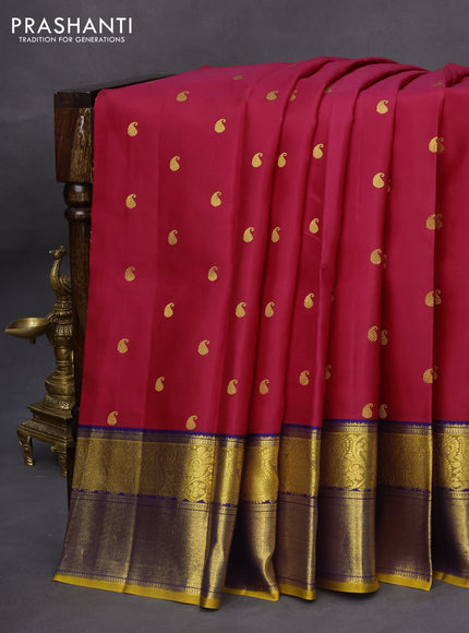 Pure kanchipuram silk saree dark pink and mustard yellow with paisley zari woven buttas and rich zari woven border