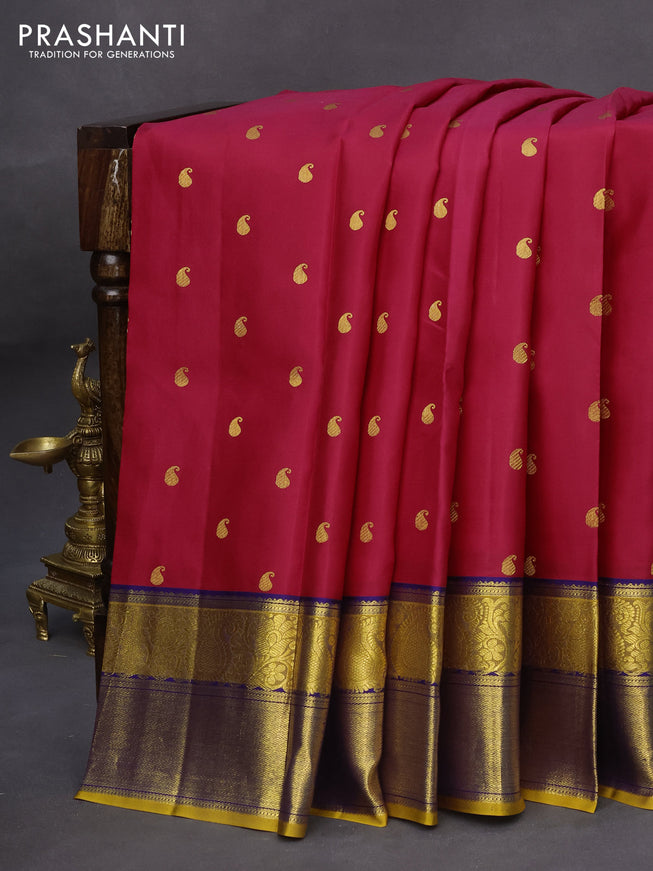 Pure kanchipuram silk saree dark pink and mustard yellow with paisley zari woven buttas and rich zari woven border