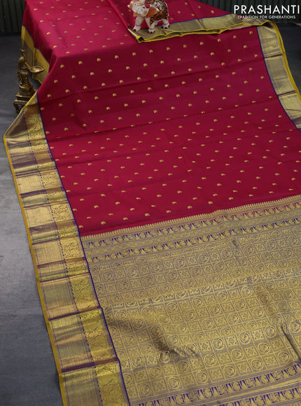 Pure kanchipuram silk saree dark pink and mustard yellow with paisley zari woven buttas and rich zari woven border