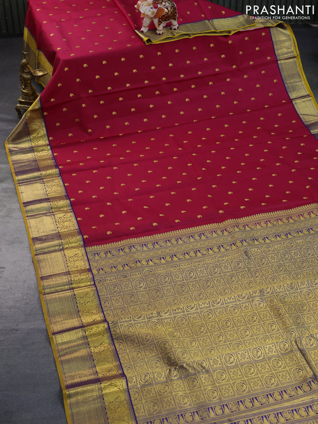 Pure kanchipuram silk saree dark pink and mustard yellow with paisley zari woven buttas and rich zari woven border