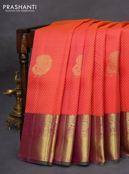 Pure kanchipuram silk saree dual shade of pinkish orange and green with allover zari woven brocade weaves and floral zari woven border