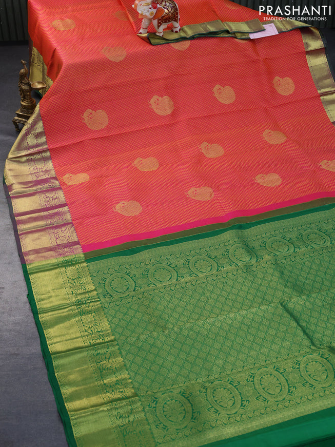 Pure kanchipuram silk saree dual shade of pinkish orange and green with allover zari woven brocade weaves and floral zari woven border