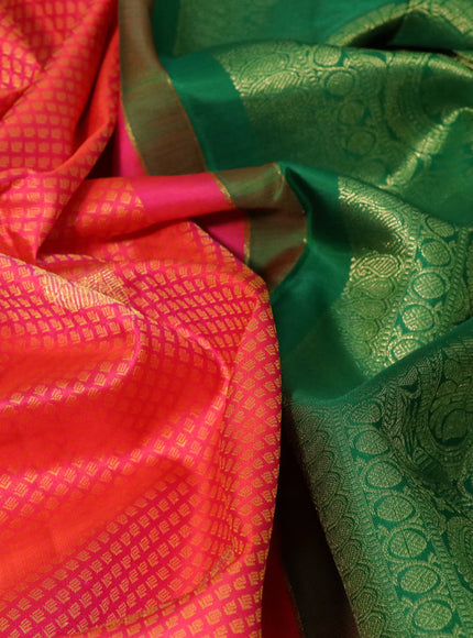 Pure kanchipuram silk saree dual shade of pinkish orange and green with allover zari woven brocade weaves and floral zari woven border