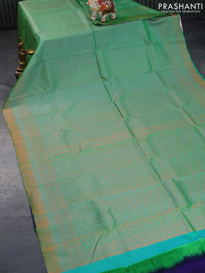 Pure kanchipuram silk saree dual shade of green and navy blue with allover copper zari woven brocade weaves and zari woven border