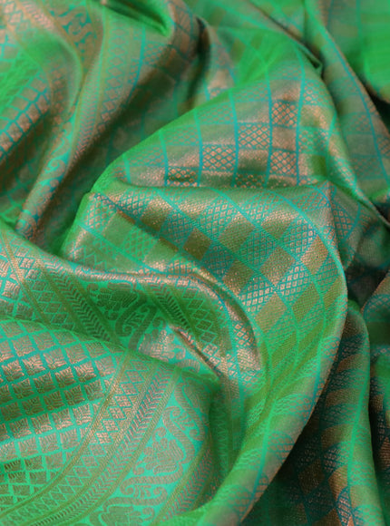 Pure kanchipuram silk saree dual shade of green and navy blue with allover copper zari woven brocade weaves and zari woven border