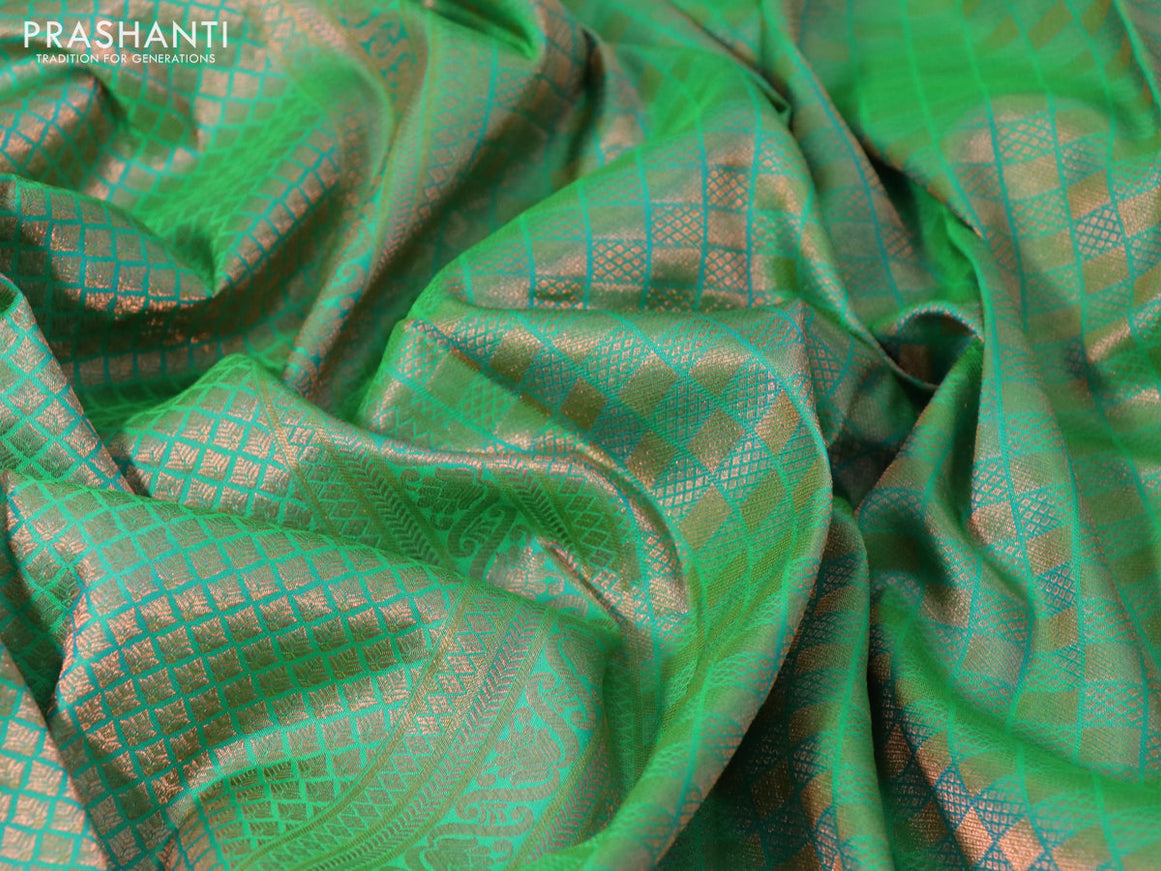 Pure kanchipuram silk saree dual shade of green and navy blue with allover copper zari woven brocade weaves and zari woven border