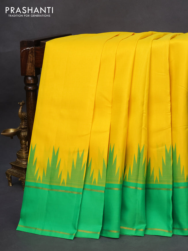 Pure kanchipuram silk saree yellow and green with plain body and temple design rettapet zari woven border