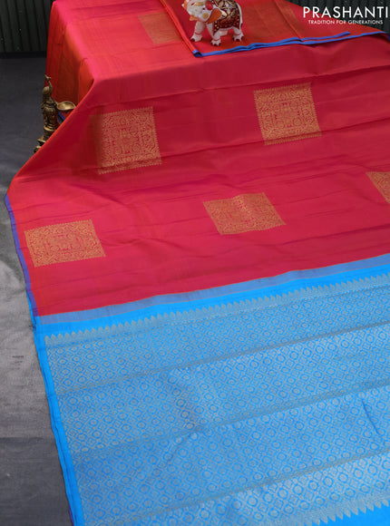 Pure kanchipuram silk saree dual shade of pinkish orange and cs blue with zari woven buttas in borderless style