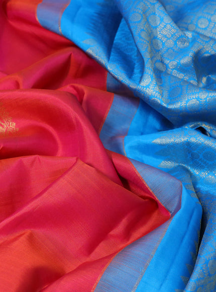 Pure kanchipuram silk saree dual shade of pinkish orange and cs blue with zari woven buttas in borderless style