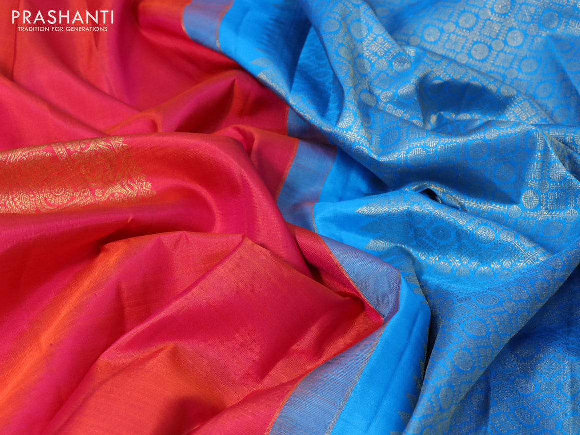 Pure kanchipuram silk saree dual shade of pinkish orange and cs blue with zari woven buttas in borderless style