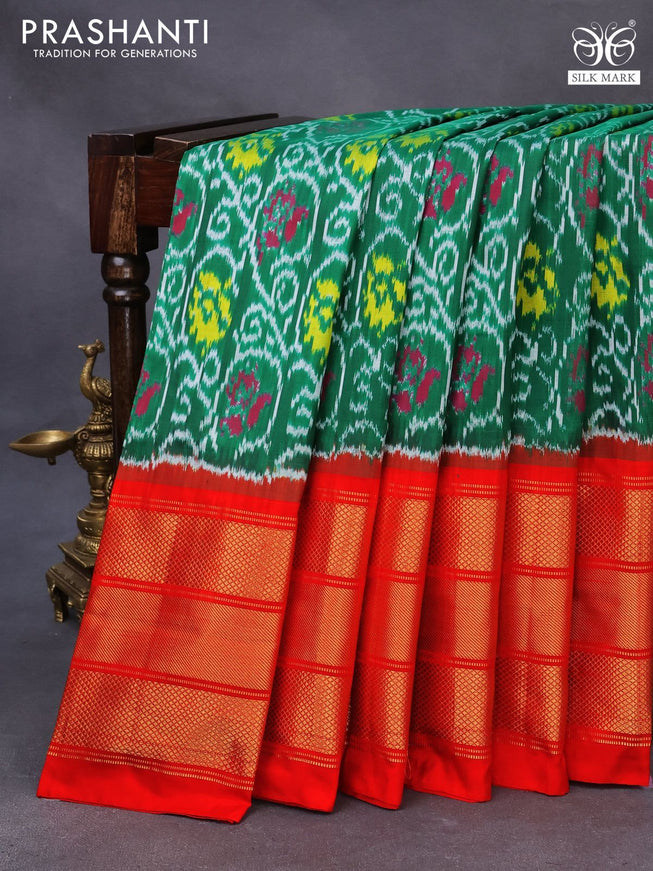 Pochampally silk saree green and orange with allover ikat weaves and long zari woven border