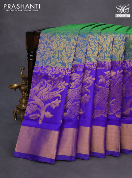 Pure uppada silk saree dual shade of bluish green and blue with allover zari woven brocade weaves and long zari woven border