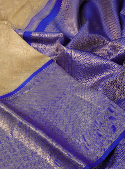 Pure kanchipuram silk saree sandal and blue with allover zari woven brocade weaves and long zari woven border