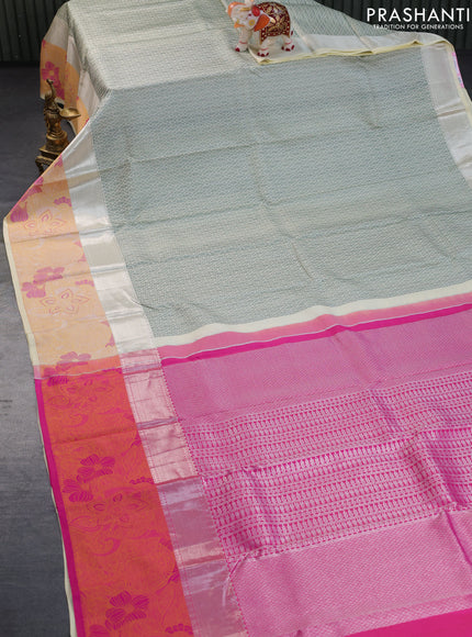 Pure kanchipuram silk saree cream and pink with allover self emboss and zari woven floral design border