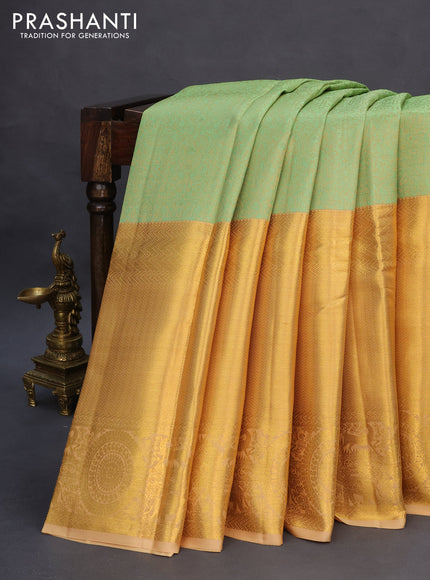 Pure kanchipuram silk saree pastel green and sandal with allover self emboss and long zari woven border