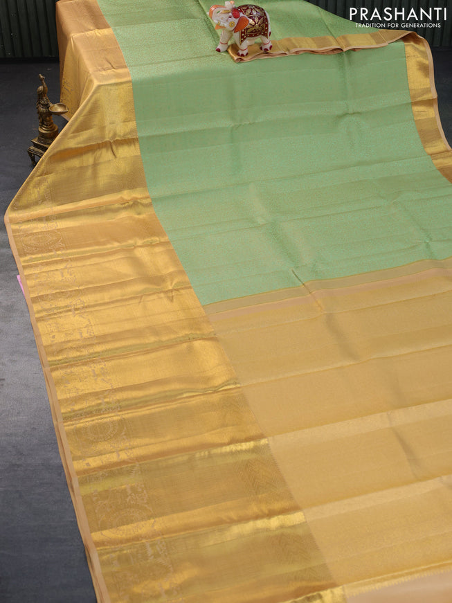 Pure kanchipuram silk saree pastel green and sandal with allover self emboss and long zari woven border