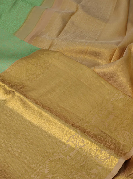 Pure kanchipuram silk saree pastel green and sandal with allover self emboss and long zari woven border