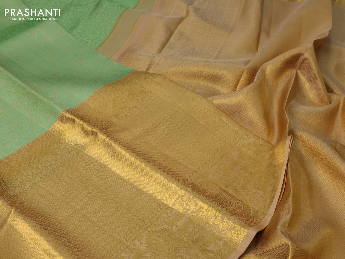 Pure kanchipuram silk saree pastel green and sandal with allover self emboss and long zari woven border